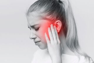 woman dealing with ear pressure